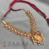 a necklace with a red string