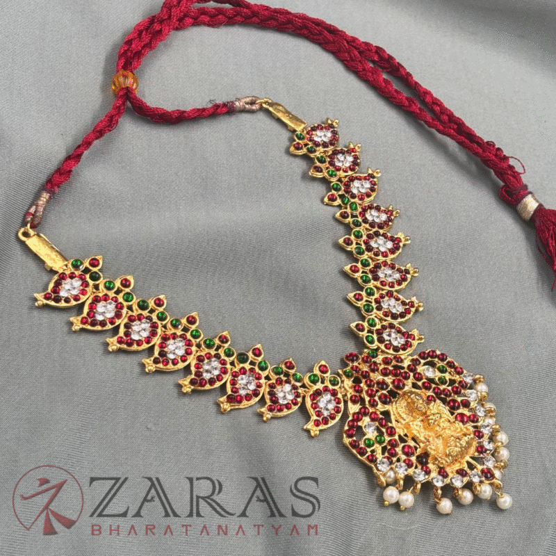 a necklace with a red string